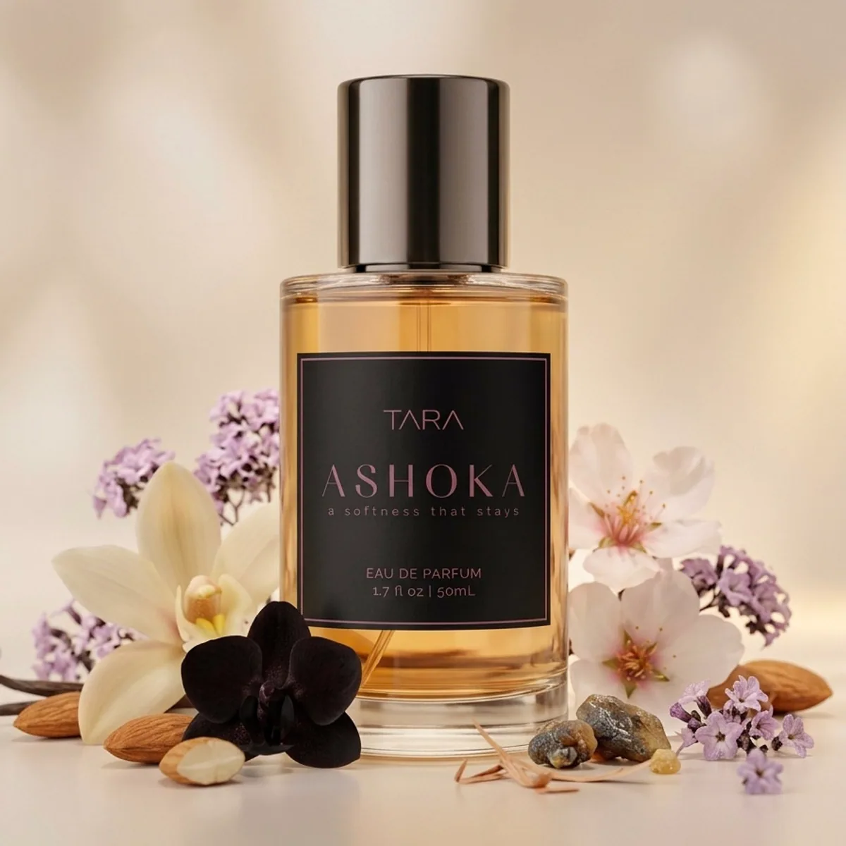 Ashoka perfume bottle styled with soft florals and almond warmth for an early customer review.