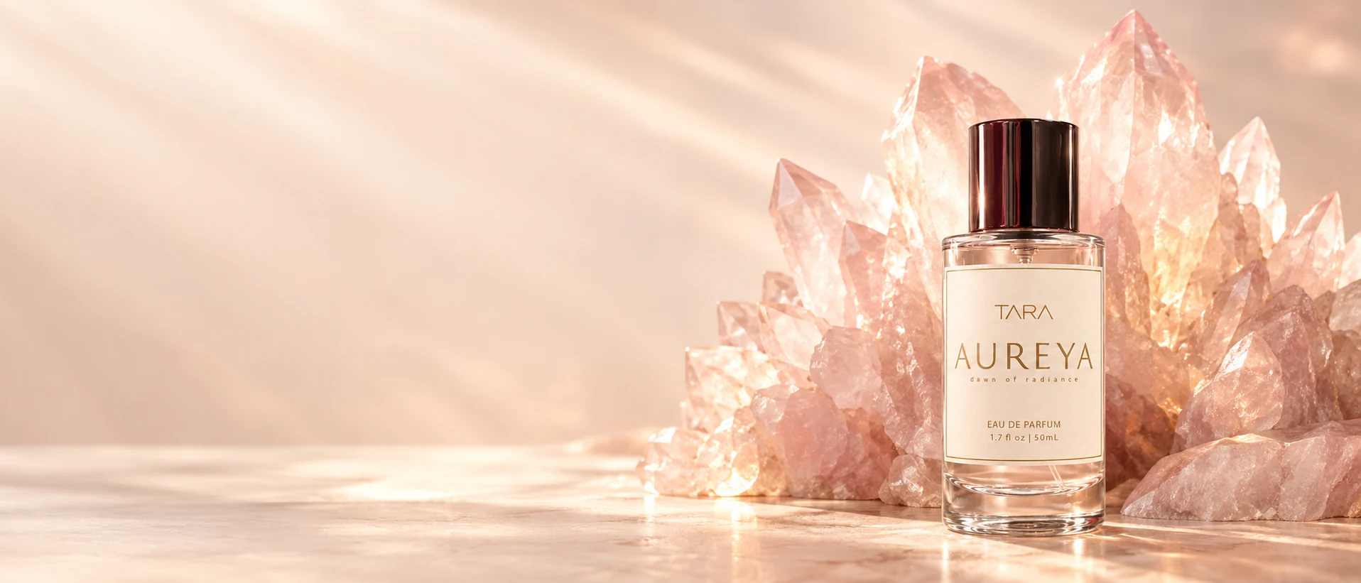AUREYA Eau de Parfum with pale Rose Quartz illuminated by golden dawn light