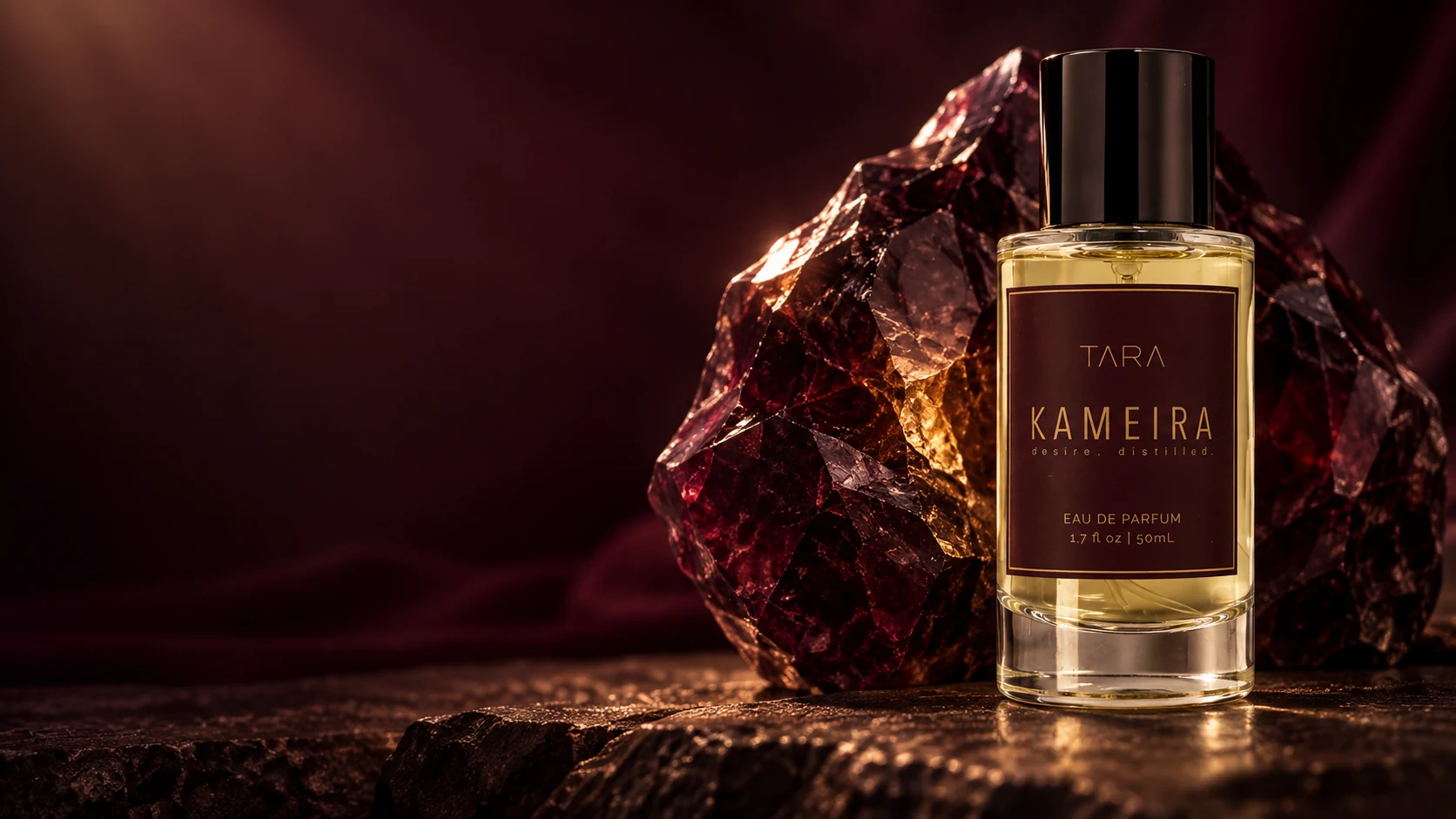 KAMEIRA Eau de Parfum with a deep rhodolite garnet and warm amber glow